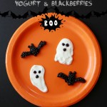 Spooky Halloween dessert - ghosts, bats made from yogurt and blackberries